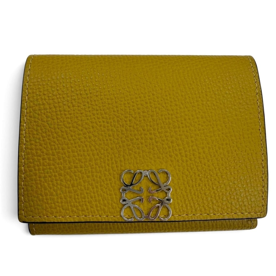 LOEWE Anagram Trifold Wallet, Grained Calf Leather, Compact Tri-fold Brown, Silver Hardware, Made in: --- Catalog ---Category: SizeSize (HxWxD): 8cm x 10.2cm / 3.14'' x 4.01''Category: DesignType: Wallet (tri-fold)Color: BrownGender: WomenMaterial: Leather Category: GeneralBrand: LoeweCountry of Origi