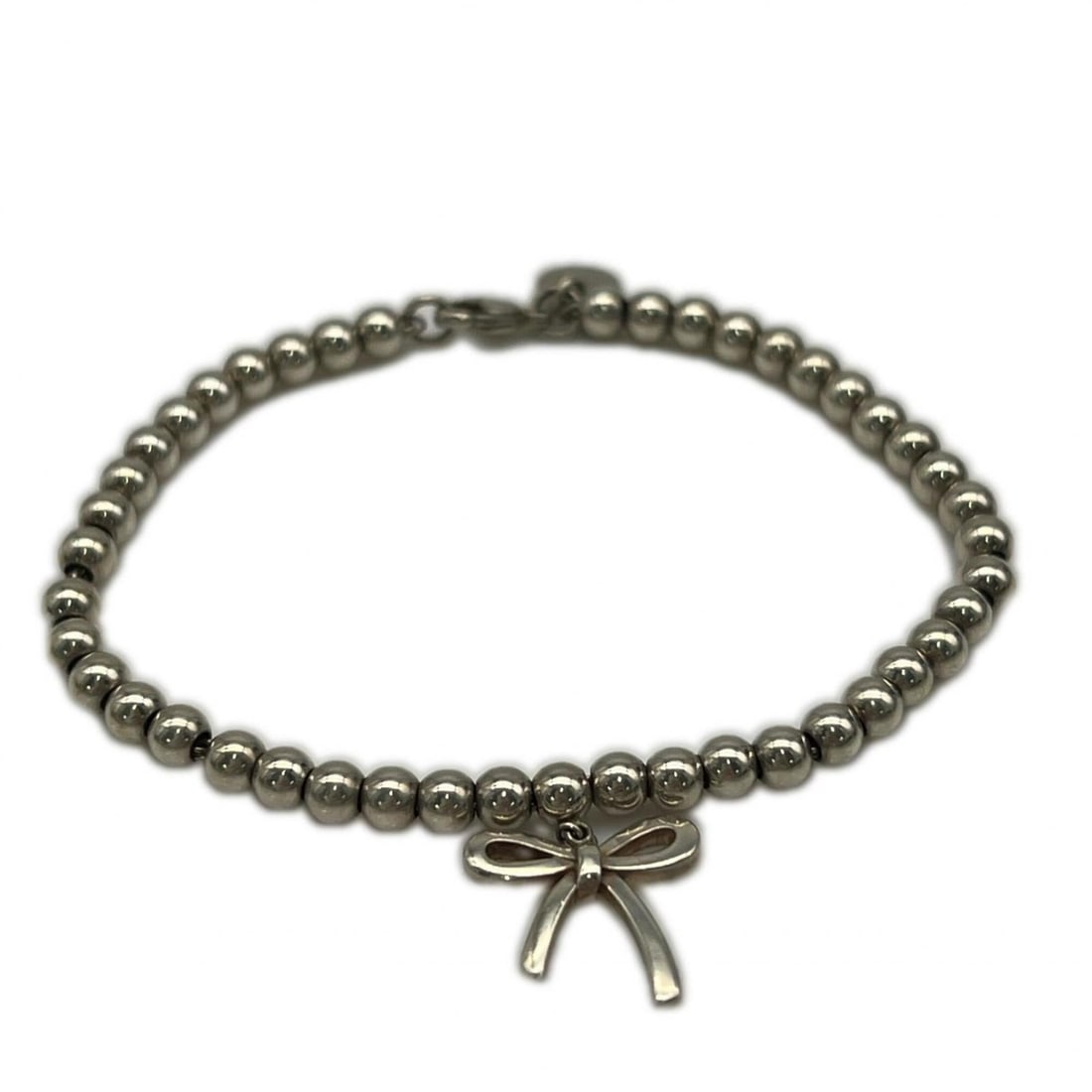 TIFFANY&Co. Ball Chain Ribbon Bracelet AG925 - for Women: --- Catalog ---Category: SizeWidth: 4mm / 0.15''Weight: 6g / 0.21oz.Total Length: 17.6cm / 6.92''Category: DesignType: Charm braceletColor: SilverGender: WomenMaterial: Silver 925Category: GeneralBran
