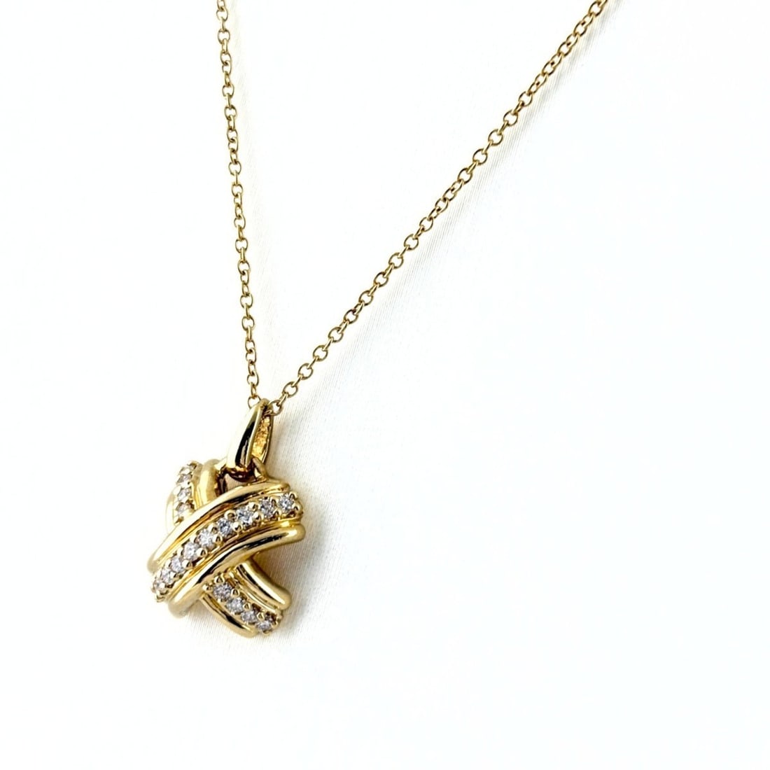 Tiffany & Co. Signature Cross Diamond Necklace, Yellow Gold (YG) Pendant 750 Diamond, Women's.: --- Catalog ---Category: SizePendant Size: 17mm x 11.6mm / 0.66'' x 0.45''Neck Circumference: 41 cm / 16.14''Category: DesignColor: YellowGender: WomenNecklace Type: Pendant necklaceCategory: GeneralB