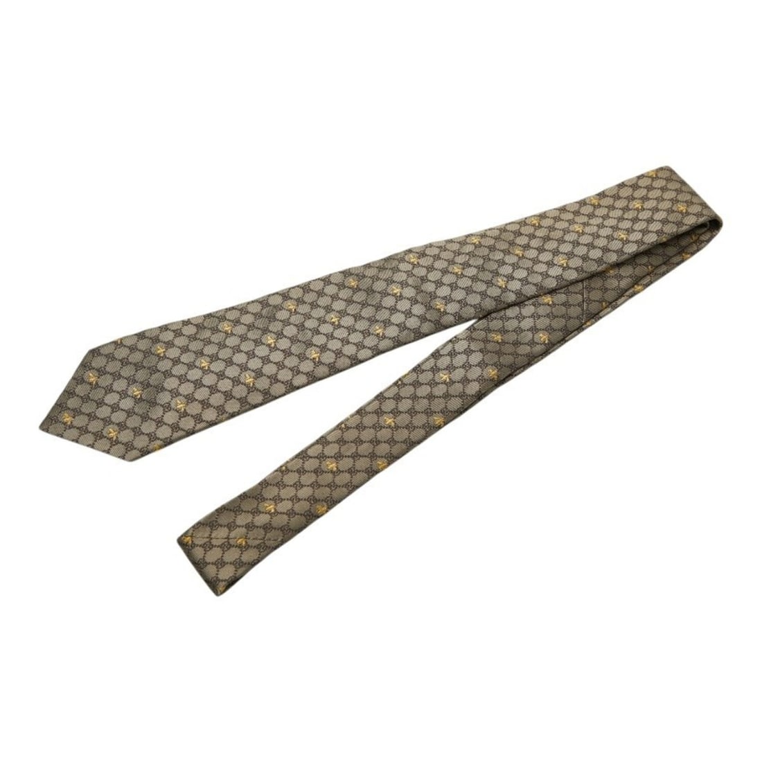 Gucci GG Bee Narrow Tie, Design, 545078, Brown/Yellow Silk, Men's.: --- Catalog ---Category: SizeWidth: 7cm / 2.75''Total Length: 148cm / 58.26''Category: DesignType: Skinny tieColor: Brown, YellowGender: MenMaterial: Silk Category: GeneralMPN: 545078Brand: Gucci--- I