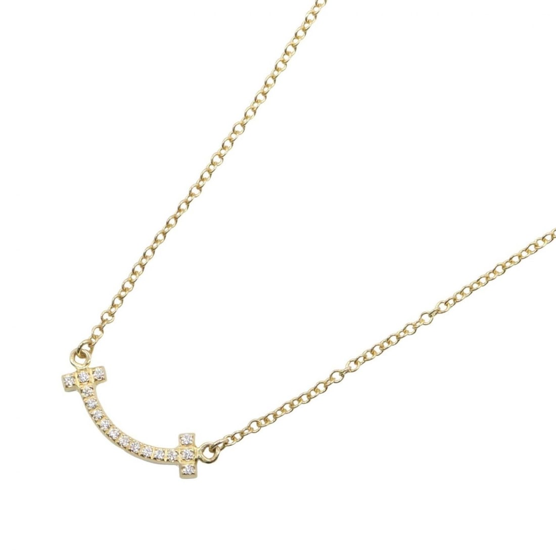 Tiffany & Co. T Smile Mini Necklace, Diamond 18K (Yellow Gold), Women's, Gold Tone, Clear 62617683: --- Catalog ---Category: SizePendant Size: 3mm x 13mm / 0.11'' x 0.51''Neck Circumference: 40.5 cm - 45.5 cm / 15.94'' - 17.91''Category: DesignColor: Clear, GoldGender: WomenMaterial: Yellow gold (18