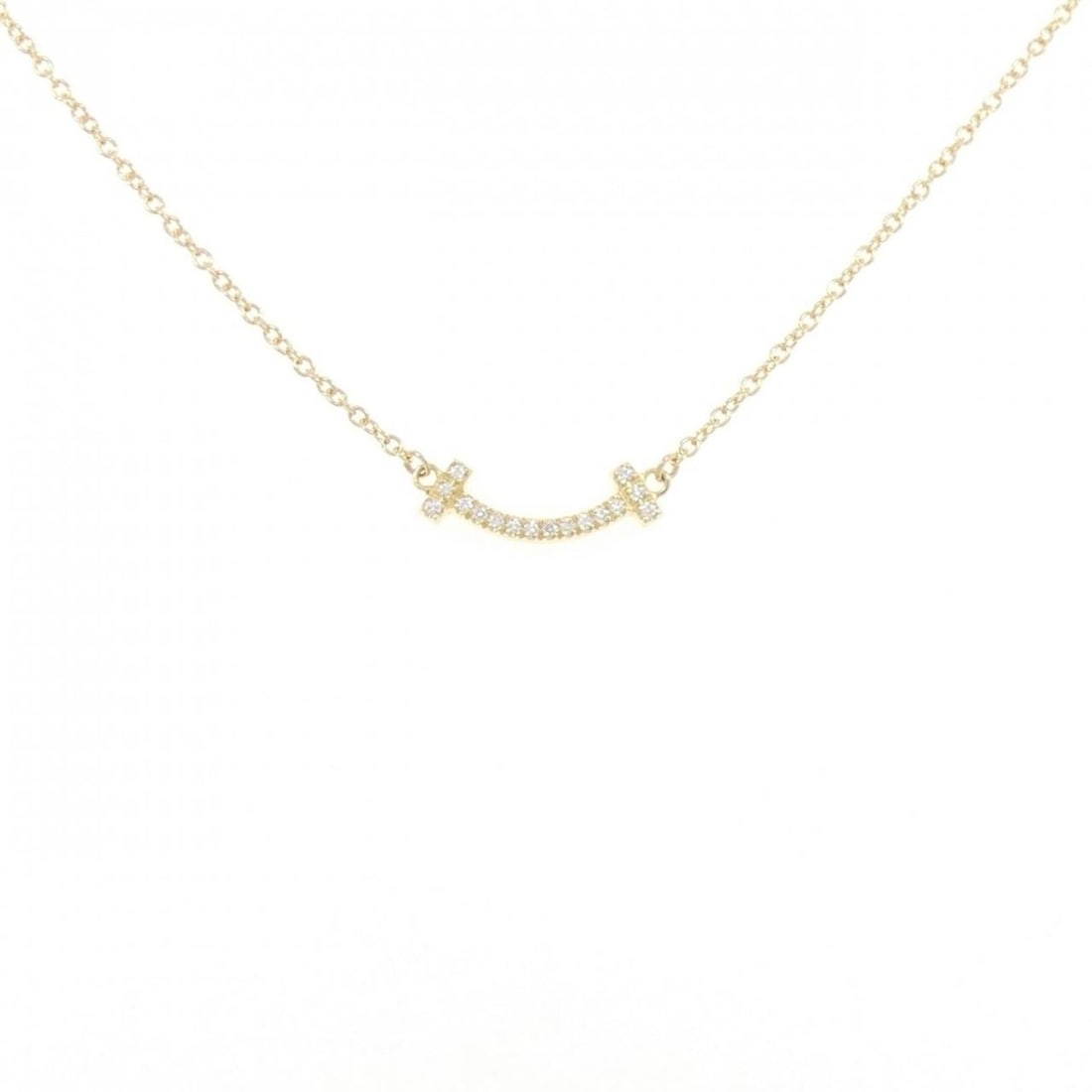 Tiffany T Smile Mini Necklace: --- Catalog ---Category: SizePendant Size: 3.7mm x 13.7mm / 0.14'' x 0.53''Neck Circumference: 41 cm - 45 cm / 16.14'' - 17.71''Category: DesignGender: WomenMaterial: Yellow gold (18K)Pendant Type: