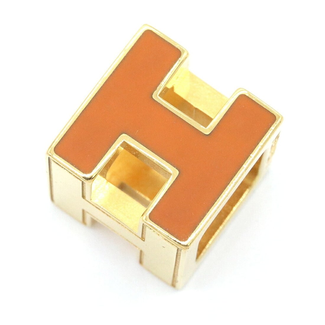 Hermes Cage d'H H-Cube Pendant Top, Orange Gold Metal Head Necklace for Women: --- Catalog ---Category: SizePendant Size: 12mm x 12mm / 0.47'' x 0.47''Category: DesignColor: Gold, OrangeGender: WomenMaterial: MetalPendant Type: PendantNecklace Type: PendantCategory: GeneralLine: