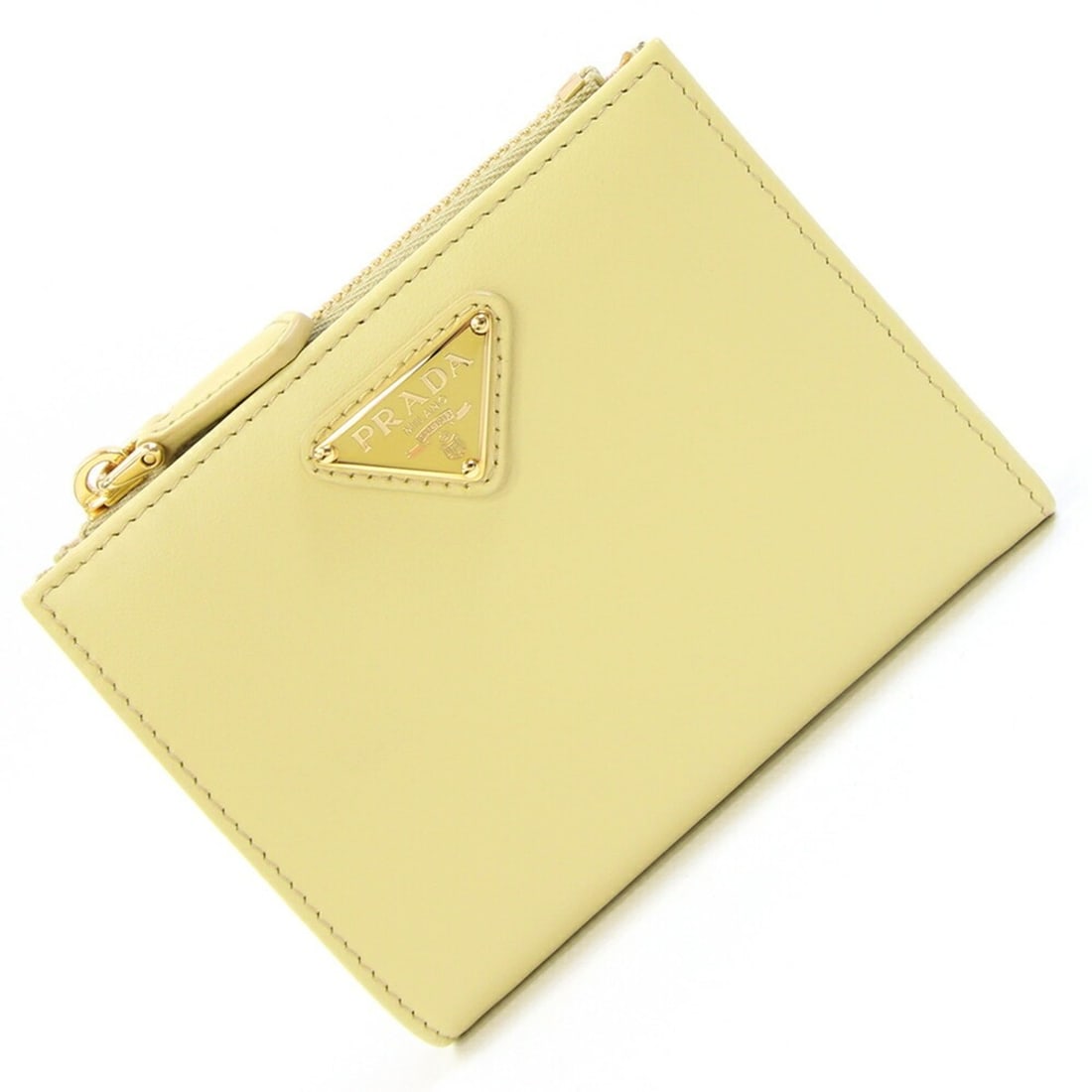 Prada Bi-fold Wallet 1ML050 Yellow Leather Compact Mini for Women PRADA: --- Catalog ---Category: SizeSize (HxWxD): 9cm x 11.5cm x 2.5cm / 3.54'' x 4.52'' x 0.98''Category: DesignType: Wallet (bi-fold)Color: YellowGender: WomenMaterial: Leather Category: GeneralBrand: Prad