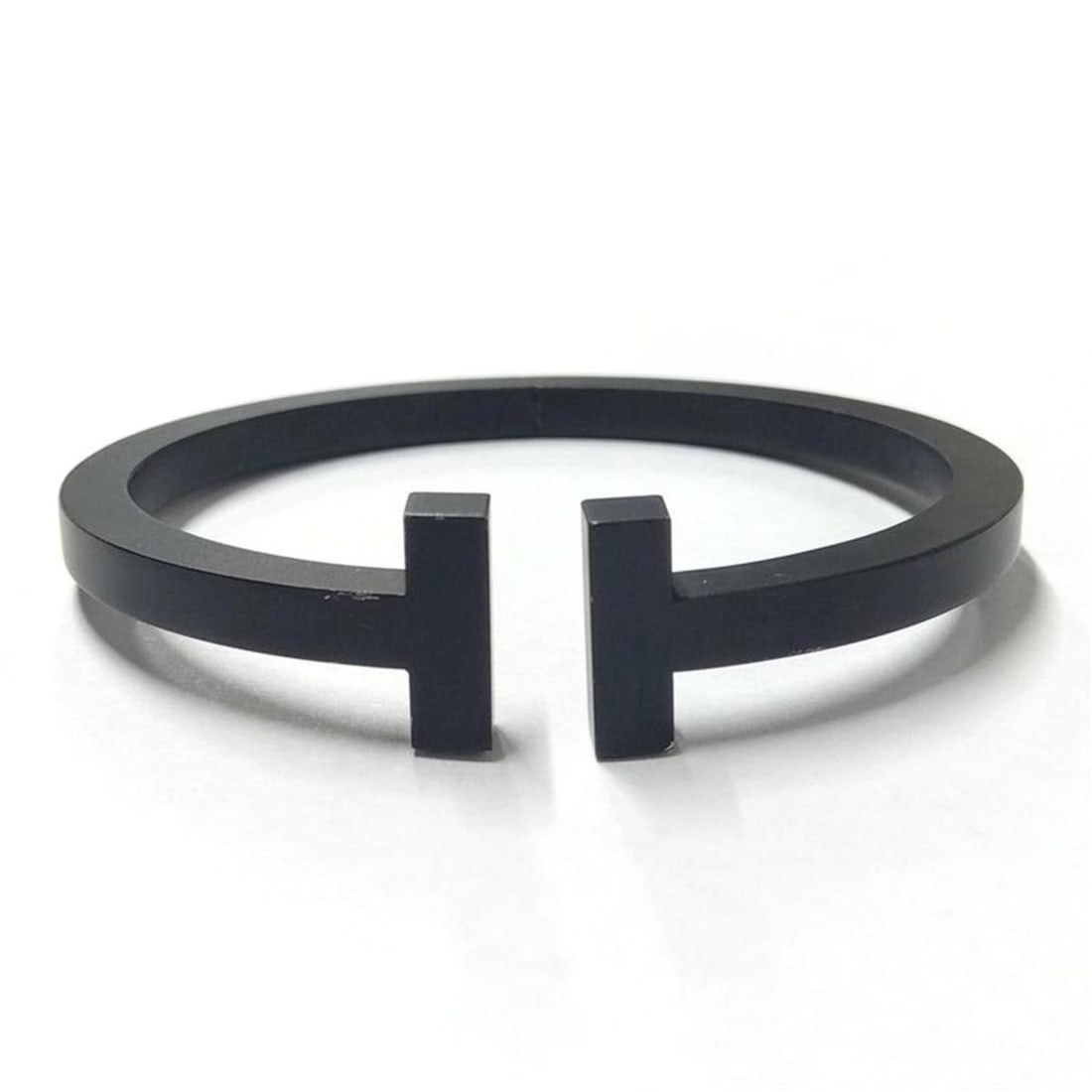 Tiffany & Co. T-Square Bracelet Bangle Cuff SSg Black: --- Catalog ---Category: SizeLength: 17cm / 6.69''Category: DesignType: Charm braceletColor: BlackGender: WomenMaterial: Stainless steelCategory: GeneralBrand: TiffanyCountry of Origin: Germany--- Ite
