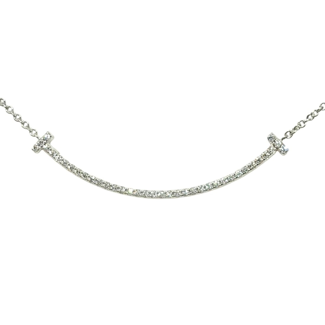 Tiffany & Co. T Smile Small Necklace with Diamonds, 18K White Gold, 2.3g, Women's: --- Catalog ---Category: SizePendant Size: 1.3mm x 37mm / 0.05'' x 1.45''Neck Circumference: 40.5 cm / 15.94''Category: DesignGender: WomenMaterial: White gold (18K)Necklace Type: NecklaceCategory: Ge