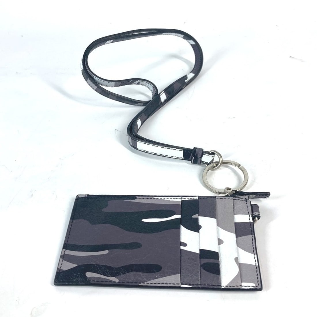 BALENCIAGA 594548 Wallet with neck strap, camouflage, business card holder, case, fragment wallet,: --- Catalog ---Category: DesignType: Card caseColor: Black, Camouflage, SilverGender: Men,Women,UnisexMaterial: Leather Category: GeneralBrand: BalenciagaCategory: Physical PropertiesSize (HxWxD): 7cm
