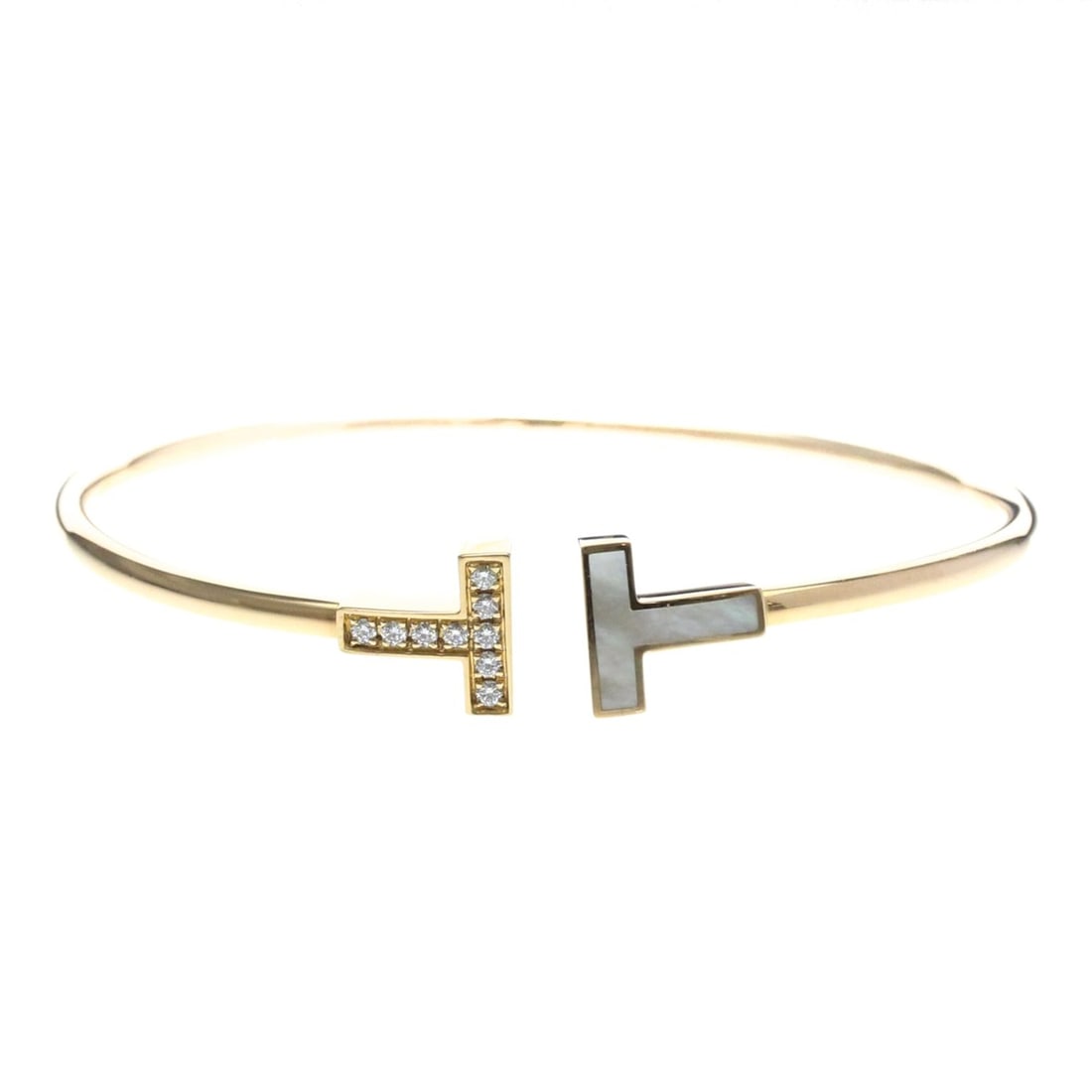 Tiffany Tiffany T T-wire Diamond MOP Bangle Pink Gold (18K) Diamond,Mother Of Pearl Bangle Pink Gold: --- Catalog ---Category: SizeWidth: 2.4cm / 0.94''Length: 16cm / 6.29''Weight: 8.2g / 0.28oz.Category: DesignType: BangleColor: Pink goldMetal: GoldStone: Diamond, Mother of pearlStyle: FashionGender: