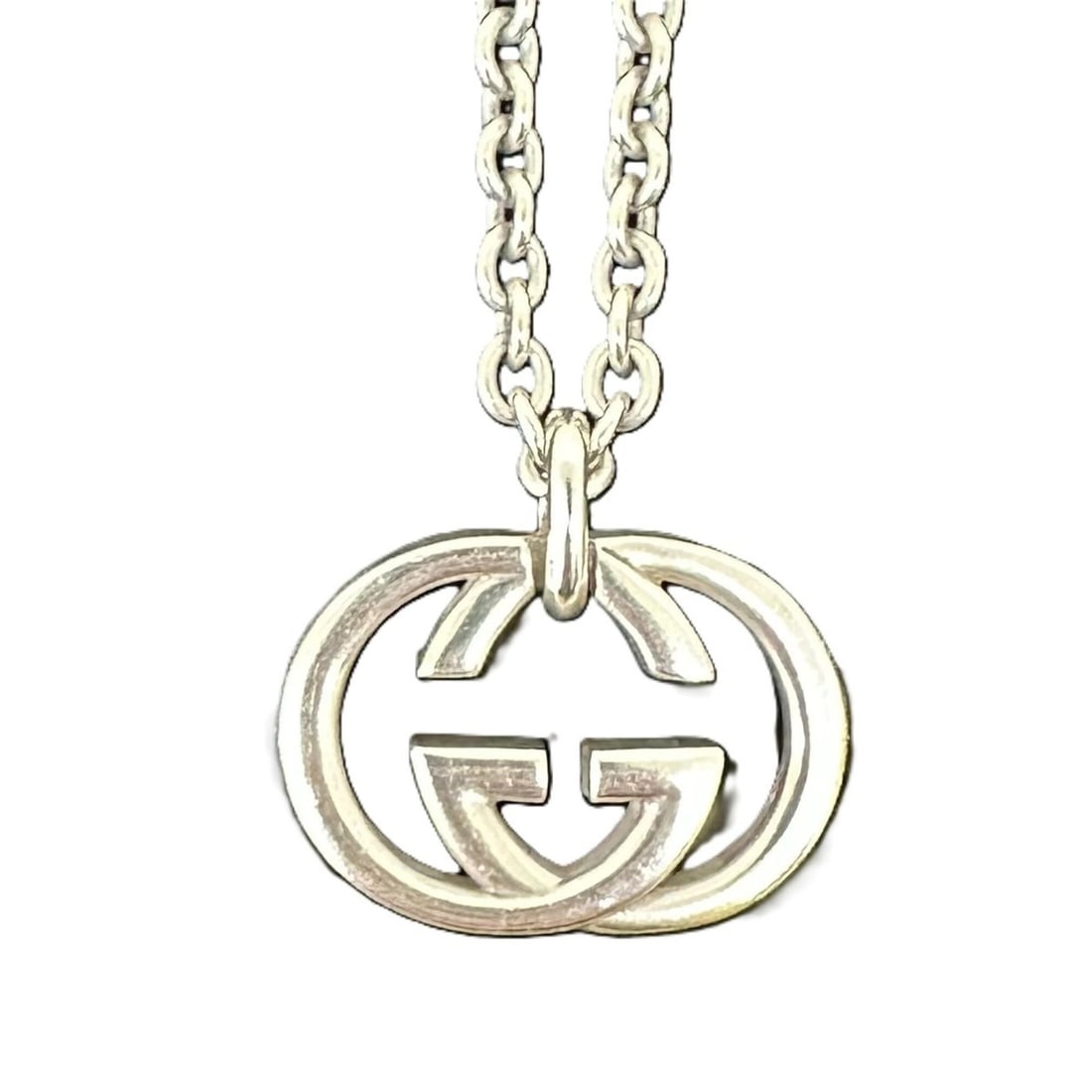 GUCCI Interlocking Necklace, Sterling Silver 925: --- Catalog ---Category: SizePendant Size: 20mm x 25mm / 0.78'' x 0.98''Neck Circumference: 46 cm / 18.11''Category: DesignColor: SilverGender: WomenMaterial: Silver 925Necklace Type: NecklaceCategory
