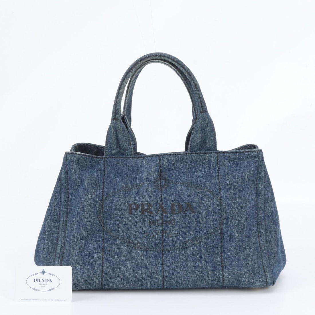 Prada Canapa Denim Blue Tote Bag (B1877B) with Guarantee Card - Women's Handbag/Shoulder: --- Catalog ---Category: SizeSize (HxWxD): 23cm x 35cm x 22cm / 9.05'' x 13.77'' x 8.66''Category: DesignType: Handbag, Shoulder bag, Tote bagColor: BlueGender: WomenCategory: GeneralBrand: PradaCount