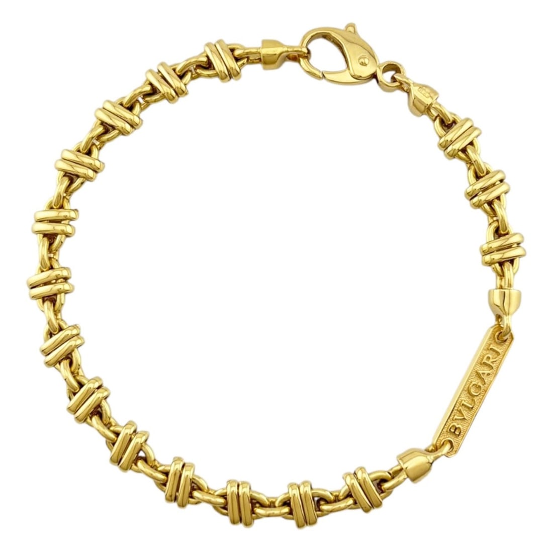 Bulgari Bracelet, 18K Yellow Gold, Women's BVLGARI: --- Catalog ---Category: SizeWidth: 6.5mm / 0.25''Weight: 22.9g / 0.8oz.Total Length: 20cm / 7.87''Category: DesignType: Charm braceletColor: GoldGender: WomenHandmade: YesMaterial: Yellow gold (18K)C