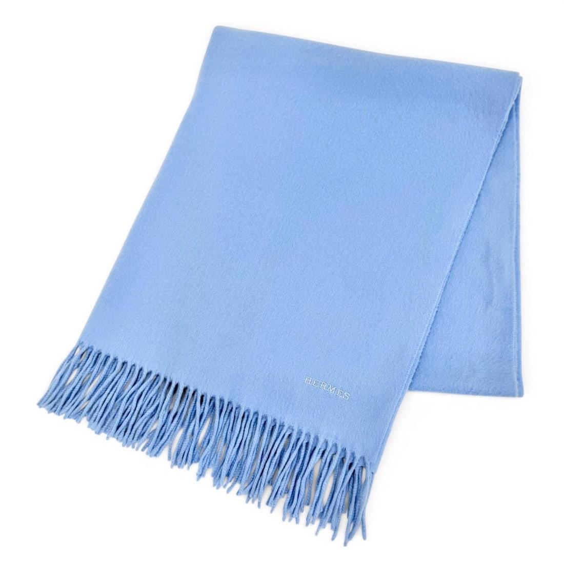 HERMES 100% Cashmere Logo Embroidered Fringe Large Shawl/Stole/Scarf Light Blue Made in Scotland: --- Catalog ---Category: SizeSize (LxW): 1.76m x 72cm / 69.29'' x 28.34''Category: DesignType: ShawlColor: Light blueGender: WomenMaterial: Cashmere Category: GeneralBrand: Hermes--- Item List
