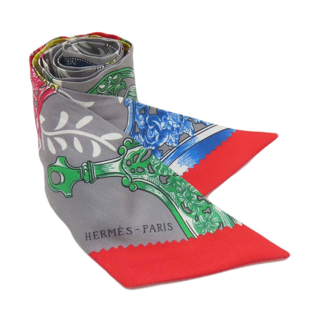 Hermes Twilly Scarf Muffler Silk Women's HERMES: --- Catalog ---Category: SizeSize (LxW): 85.5cm x 5cm / 33.66'' x 1.96''Category: DesignType: ScarfColor: GrayGender: WomenMaterial: Silk Category: GeneralLine: TwillyBrand: Hermes--- Item List ---Sec