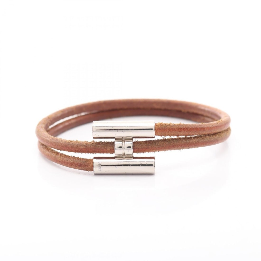 Hermes Tourni Tresse Bracelet - Leather and Stainless Steel Women's Brown/Silver Tones: --- Catalog ---Category: SizeLength: 18cm / 7.08''Category: DesignType: Charm braceletColor: Brown, SilverGender: WomenMaterial: Leather, Stainless steelCategory: GeneralBrand: Hermes--- Item List ---