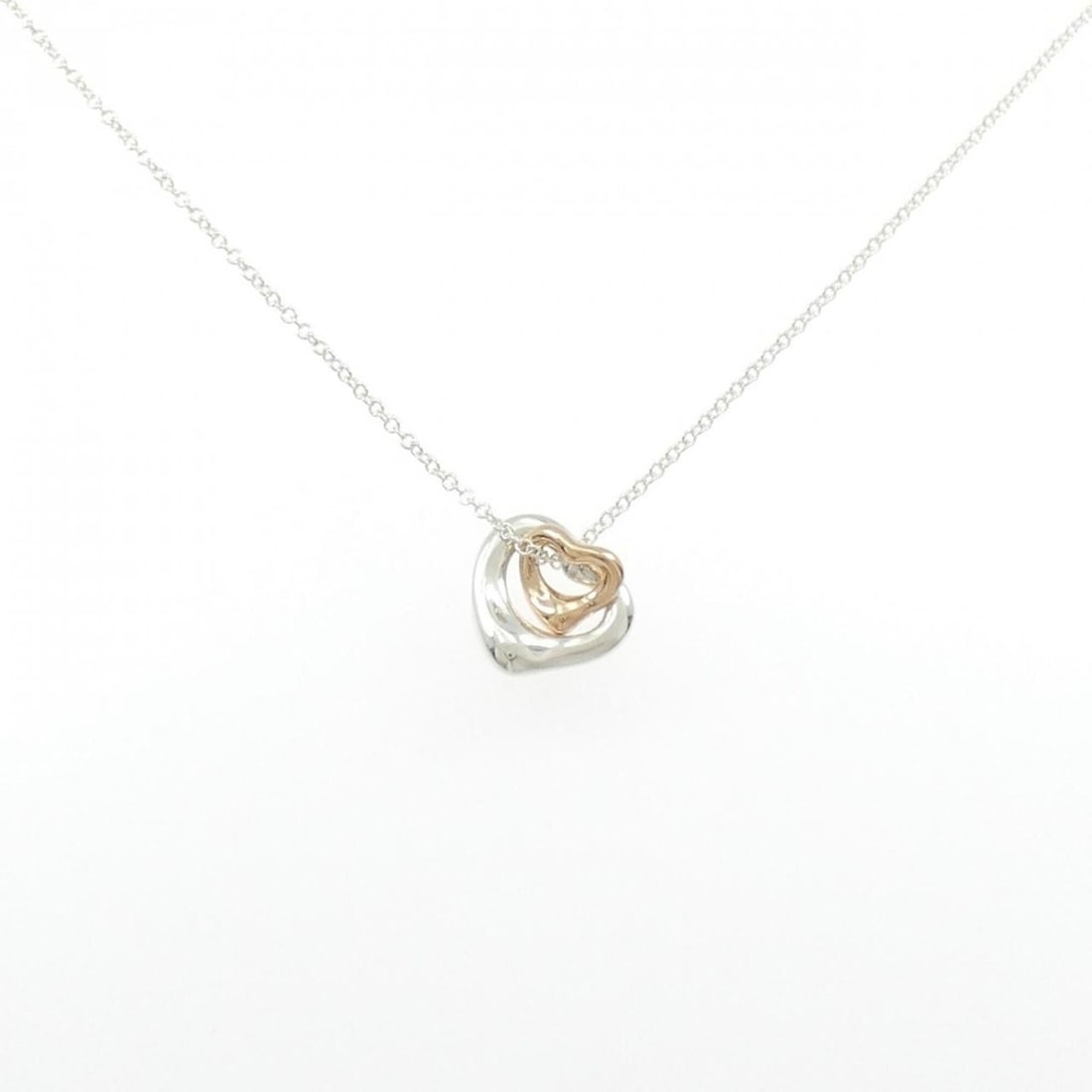 Tiffany Open Heart Extra Mini Necklace: --- Catalog ---Category: SizePendant Size: 10.9mm x 10.3mm / 0.42'' x 0.4''Neck Circumference: 40 cm / 15.74''Category: DesignGender: WomenMaterial: Pink gold (18K), Silver 925Pendant Type:
