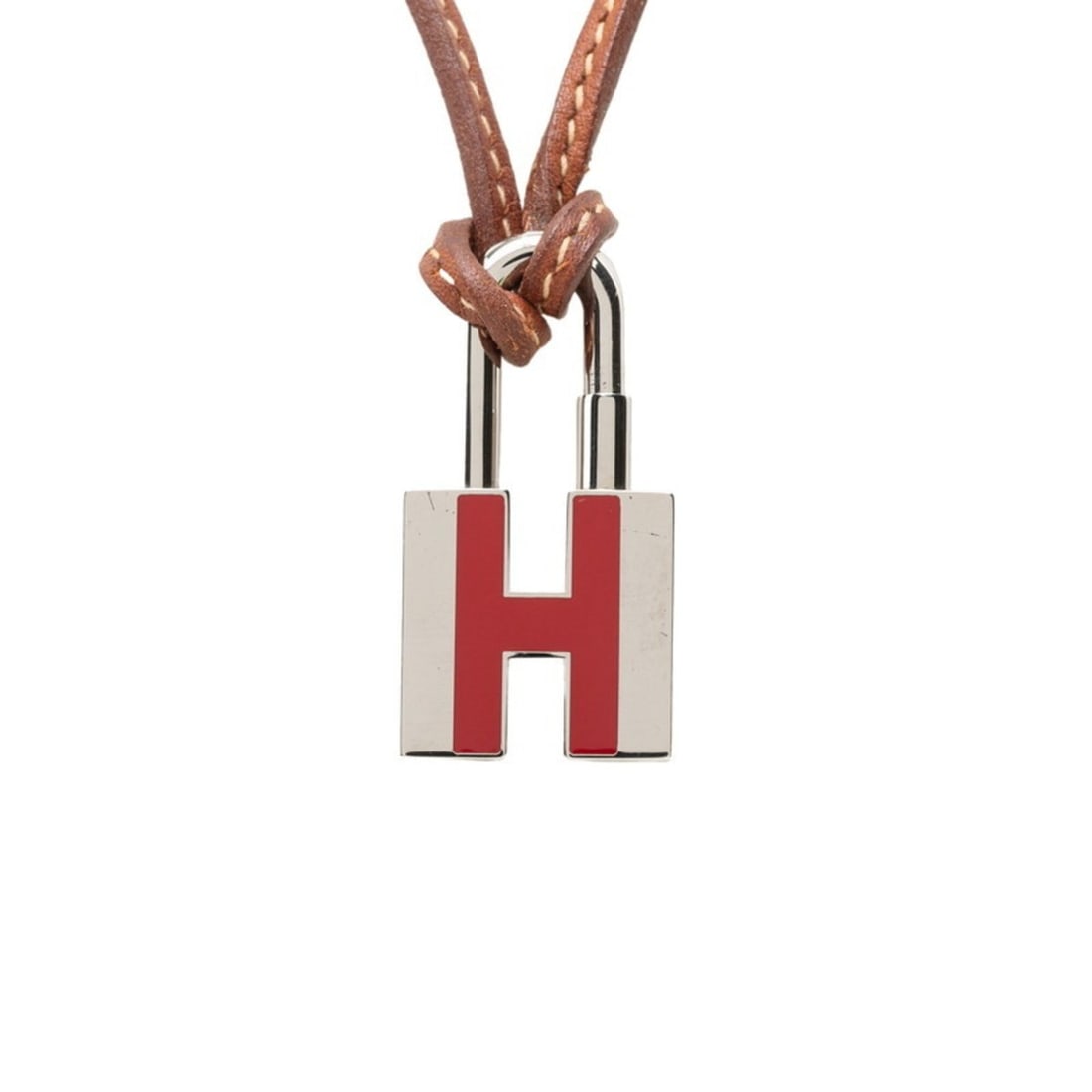 Hermes Cadena H-motif Necklace, Silver and Brown Metal Leather, Women's: --- Catalog ---Category: SizePendant Size: 20mm x 39.9mm / 0.78'' x 1.57''Neck Circumference: 61 cm / 24.01''Category: DesignColor: BrownGender: WomenMaterial: Leather, MetalNecklace Type: NecklaceCat