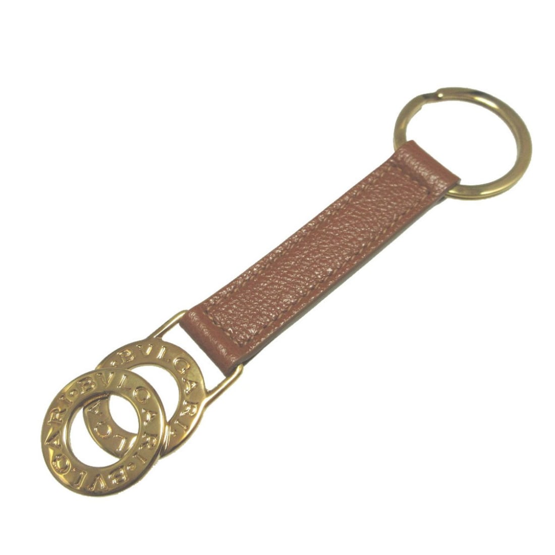 Bulgari Doppio Tondo Leather Metal Brown Gold Keychain Keyring 1655BVLGARI: --- Catalog ---Category: SizeSize (HxWxD): 3.2cm x 13cm / 1.25'' x 5.11''Category: DesignType: KeyringColor: Brown, GoldGender: Women,MenMaterial: Leather, MetalCategory: GeneralBrand: BvlgariCountry 