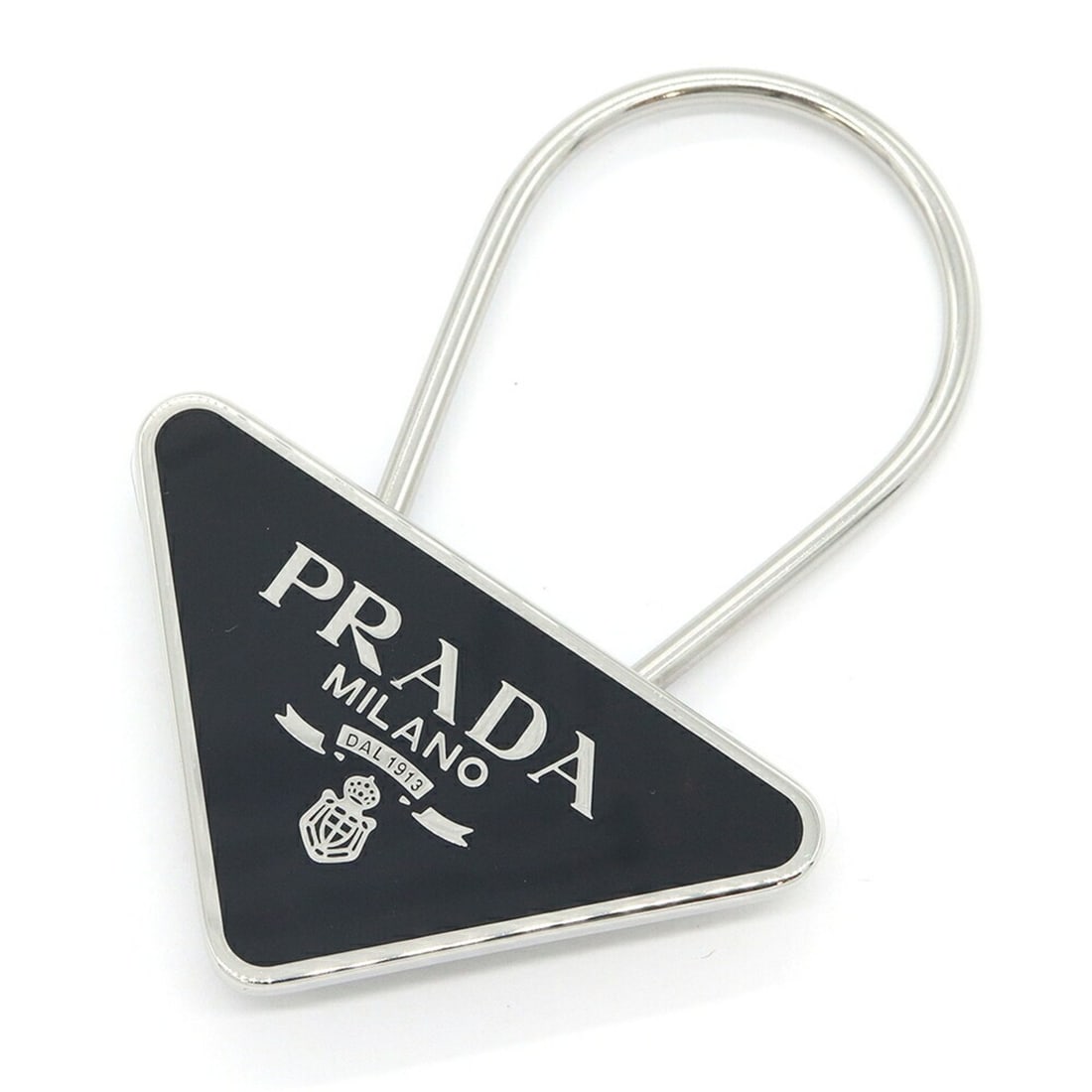 Prada Triangle Keyring 2PS395 Silver Black Metal Keychain Men's Keys PRADA: --- Catalog ---Category: SizeSize (HxWxD): 5cm x 7cm / 1.96'' x 2.75''Category: DesignType: KeyringColor: BlackGender: MenMaterial: MetalCategory: GeneralMPN: 2PS395Brand: Prada--- Item List