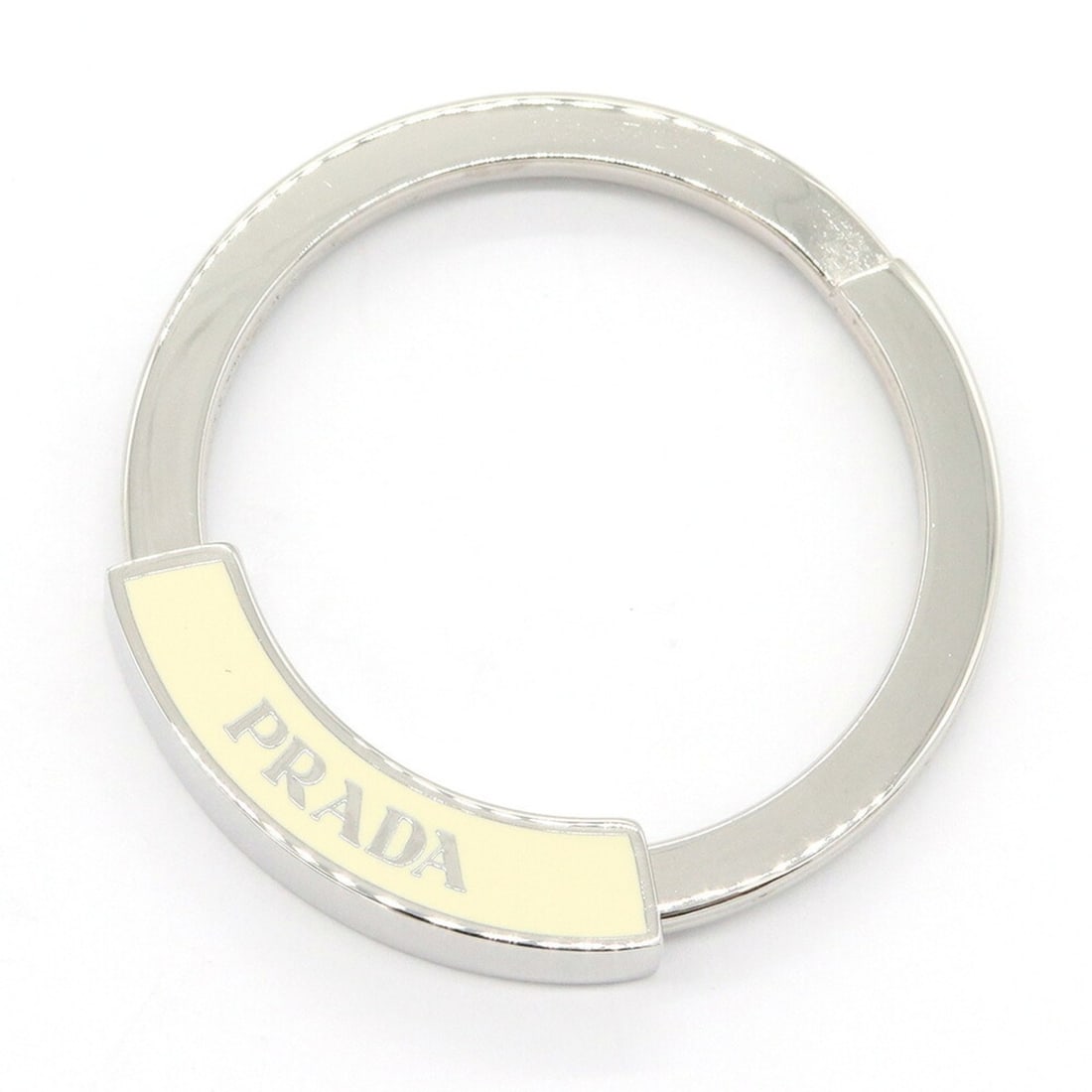 Prada Keyring 1AP023 Ivory Silver Metal Keychain Charm Circle Women's Men's PRADA: --- Catalog ---Category: SizeRing Diameter: 4.09cm / 1.61''Category: DesignType: KeyringColor: IvoryGender: Men,WomenMaterial: MetalCategory: GeneralMPN: 1AP023Brand: PradaCountry of Origin: Italy---