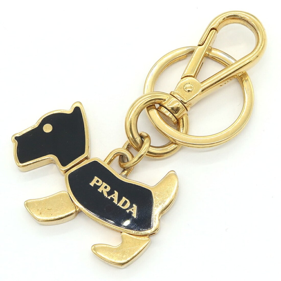Prada Dog Keychain 1PS402 Gold Black Metal Animal Keyring Key Holder for Women PRADA: --- Catalog ---Category: SizeSize (HxWxD): 9cm x 5cm / 3.54'' x 1.96''Ring Diameter: 3.2cm / 1.25''Category: DesignType: KeyringColor: BlackGender: WomenCategory: GeneralMPN: 1PS402Brand: Prada---
