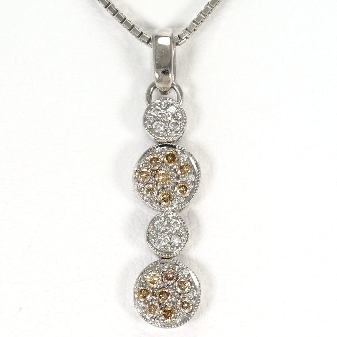 18K (18-karat white gold) necklace with brown diamond (no carat marking) and marking). Includes: --- Catalog ---Category: SizeWeight: 3.8g / 0.13oz.Pendant Size: 24mm x 5mm / 0.94'' x 0.19''Neck Circumference: 45 cm / 17.71''Category: DesignColor: Brown, White goldMetal: White GoldStone: DiamondG