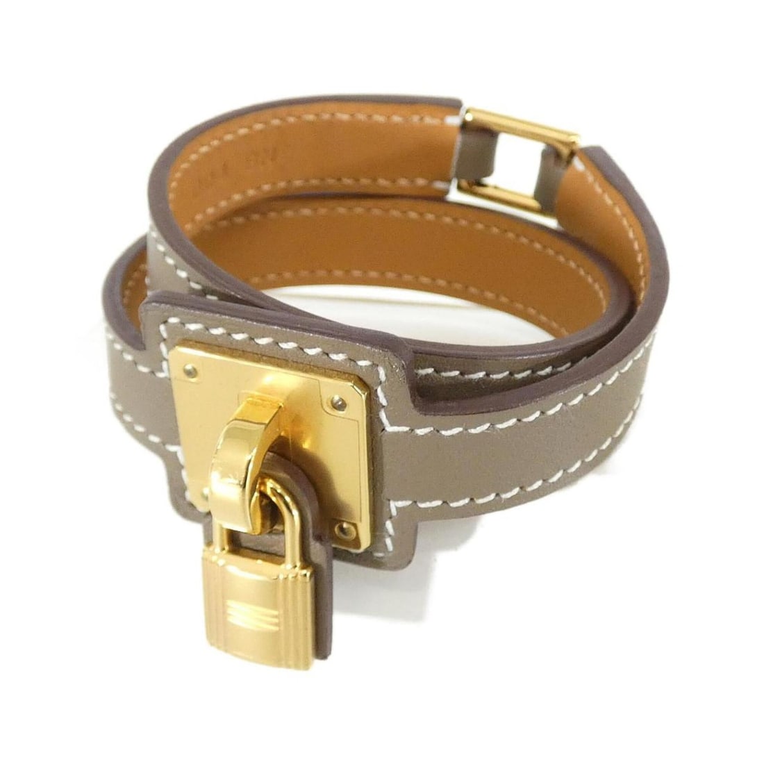 Hermes O'Kelly 079504CC Bracelet: --- Catalog ---Category: SizeLength: 15cm / 5.9''Category: DesignType: Charm braceletColor: Etoupe grayGender: WomenMaterial: Swift leatherCategory: GeneralMPN: 079504CCBrand: Hermes--- Item List