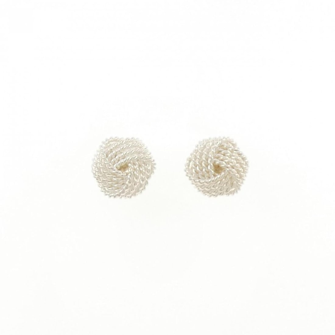 Tiffany Twist Knot Earrings: --- Catalog ---Category: SizeSize (HxWxD): 9.60mm x 9.60mm / 0.38'' x 0.38''Category: DesignType: Stud earringsGender: WomenMaterial: Silver 925Category: GeneralBrand: Tiffany--- Item List ---Section: