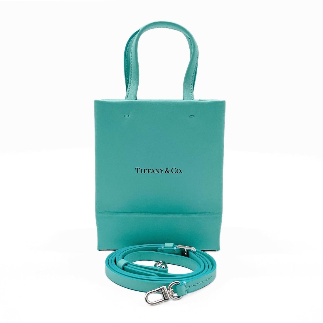 TIFFANY&Co. Tiffany Shopping Tote Mini Handbag Logo Leather Blue Men's Women's: --- Catalog ---Category: SizeSize (HxWxD): 15cm x 12cm x 7.5cm / 5.9'' x 4.72'' x 2.95''Category: DesignType: HandbagColor: Blue, Tiffany blueGender: Men,WomenMaterial: Leather Category: GeneralBrand: