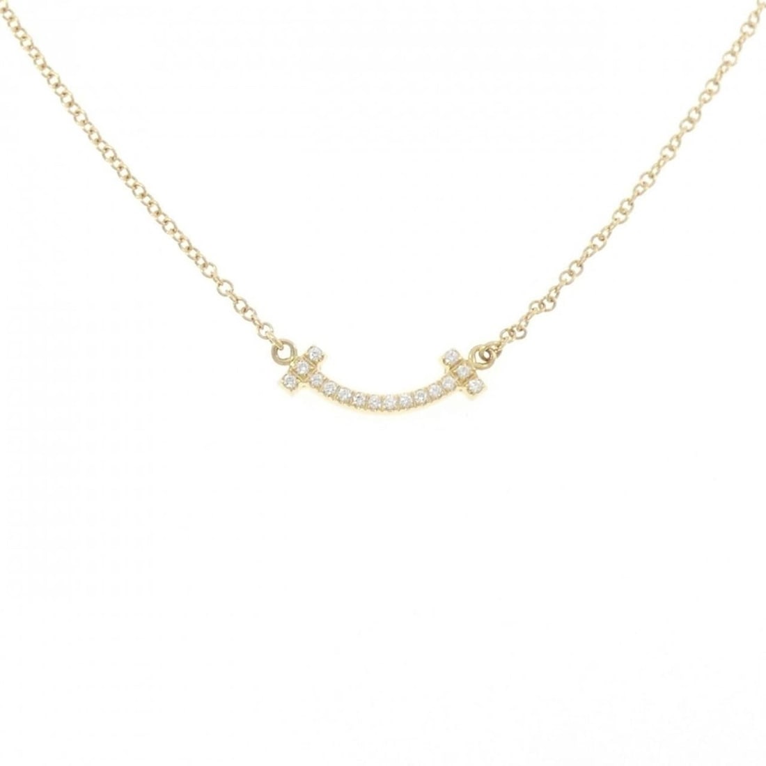 Tiffany T Smile Mini Necklace: --- Catalog ---Category: SizePendant Size: 3.6mm x 13.6mm / 0.14'' x 0.53''Neck Circumference: 41 cm - 46 cm / 16.14'' - 18.11''Category: DesignGender: WomenMaterial: Yellow gold (18K)Pendant Type: