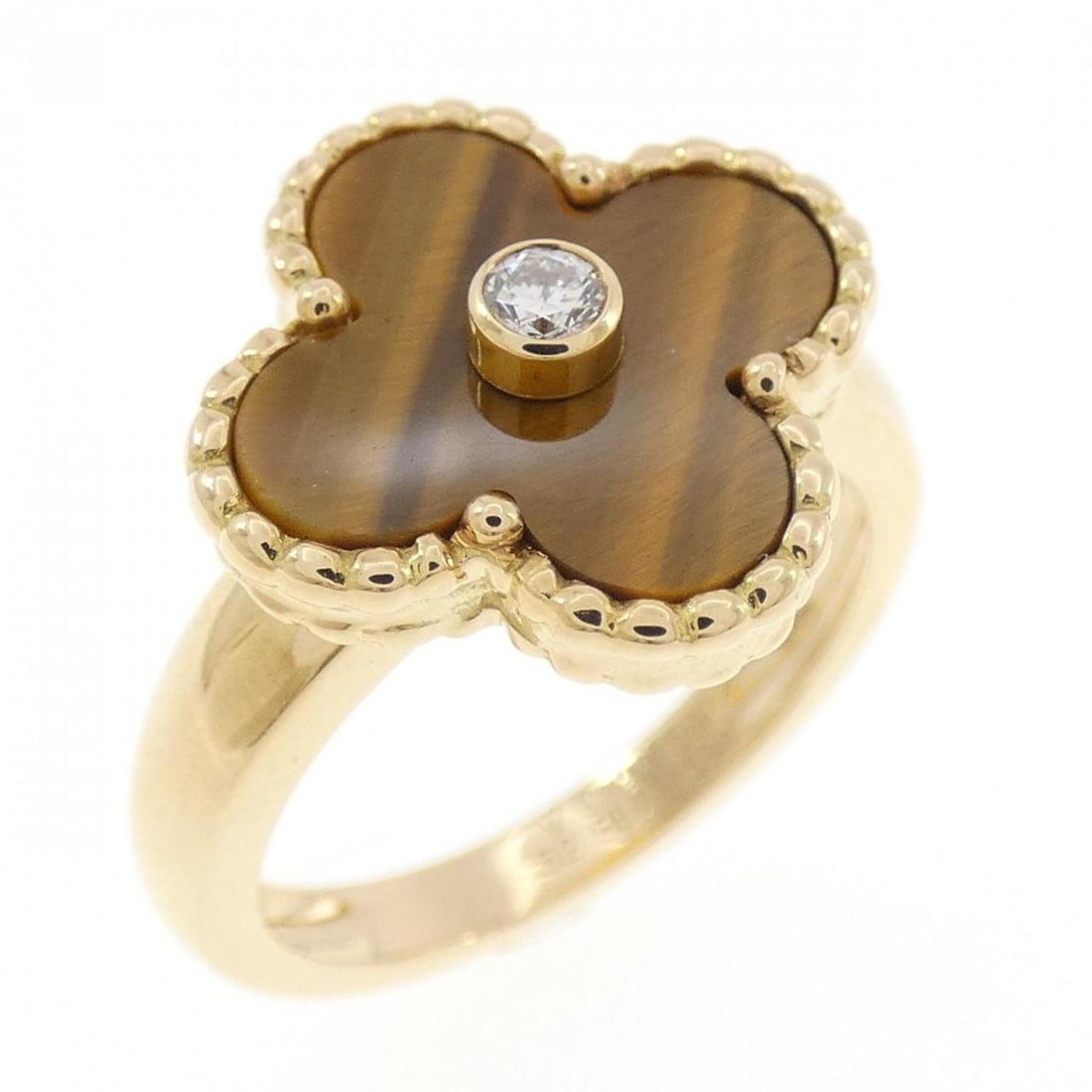 Van Cleef & Arpels Tiger's Eye Ring: --- Catalog ---Category: SizeUS Size: 6.5Brand Size: 52Category: DesignType: Band ringGender: WomenMaterial: Yellow gold (18K)Category: GeneralBrand: Van Cleef & Arpels--- Item List ---Section: