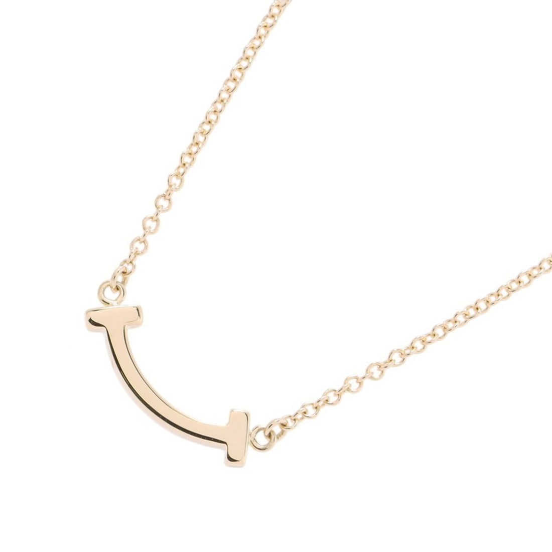 Tiffany & Co. T Smile Pendant Mini Necklace, 18K Yellow Gold, 62617640.: --- Catalog ---Category: SizeWeight: 2.2g / 0.07oz.Pendant Size: 3.5mm x 13.7mm / 0.13'' x 0.53''Neck Circumference: 40.5 cm - 45.5 cm / 15.94'' - 17.91''Category: DesignGender: WomenMaterial: Yellow 
