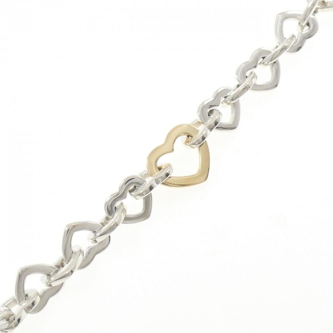Tiffany Heart Link Bracelet: --- Catalog ---Category: SizeLength: 19.5cm / 7.67''Category: DesignType: Charm braceletGender: WomenMaterial: Silver 925, Yellow gold (18K)Category: GeneralBrand: Tiffany--- Item List ---Section: