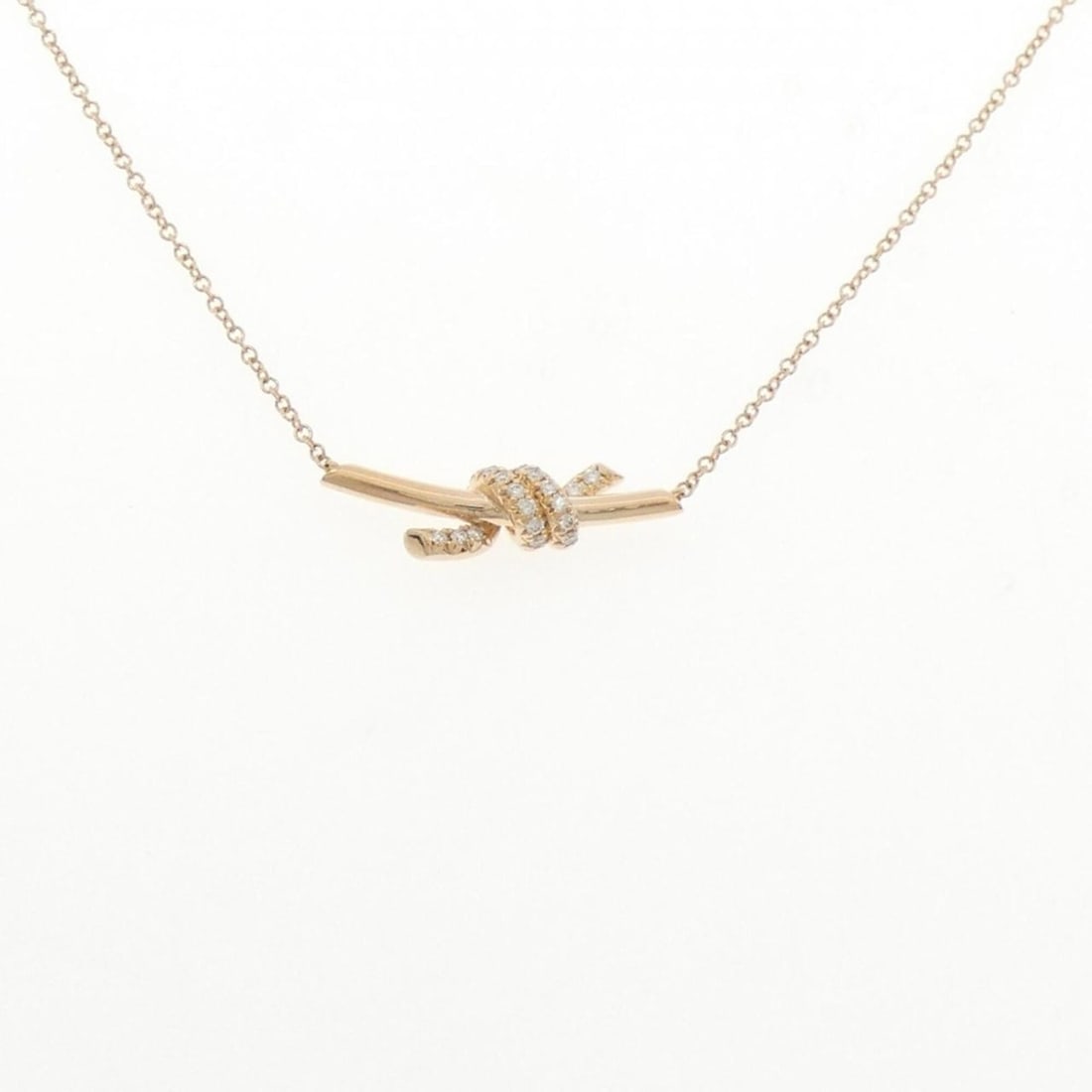 Tiffany Knot Small Necklace: --- Catalog ---Category: SizePendant Size: 6.4mm x 21.1mm / 0.25'' x 0.83''Neck Circumference: 38 cm - 43 cm / 14.96'' - 16.92''Category: DesignStone: DiamondGender: WomenMaterial: Pink gold
