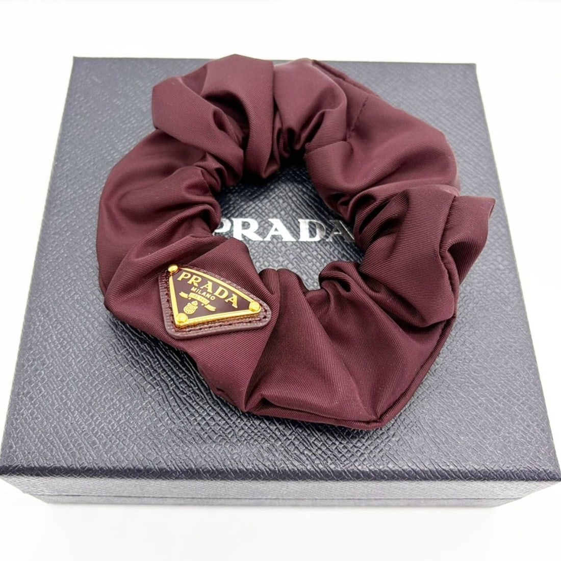 Prada Re-Nylon Scrunchie Gold Triangle Bordeaux Color PRADA (1 of 10)