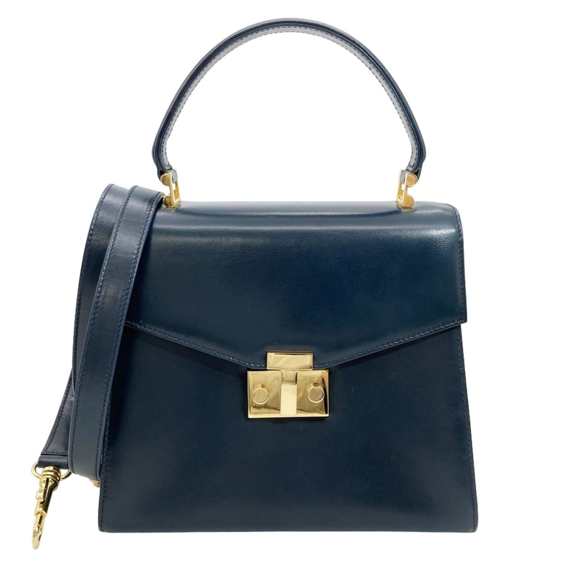 Tiffany & Co. handbag, leather, navy, gold hardware, T logo, vintage.: --- Catalog ---Category: SizeHandle Drop: 10.50cm / 4.13''Size (HxWxD): 21cm x 23cm x 12cm / 8.26'' x 9.05'' x 4.72''Strap Length: 105cm / 41.33''Category: DesignType: HandbagColor: NavyGender: WomenS