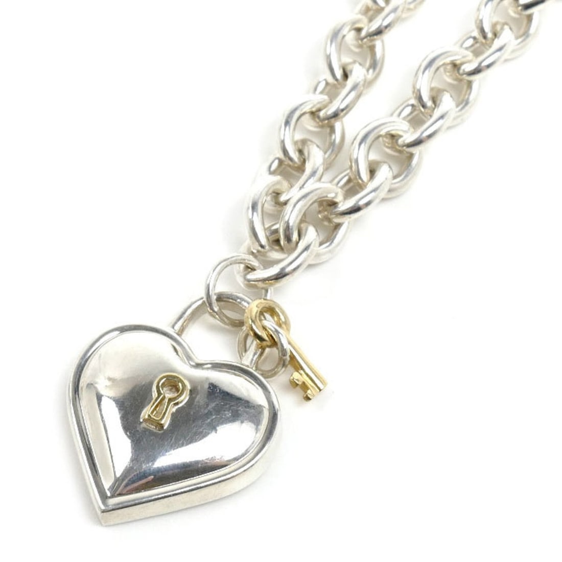 TIFFANY&Co. Tiffany & Co. Sterling Silver 925 18K Yellow Gold Heart Lock Necklace 60.5g 40cm Women's: --- Catalog ---Category: SizePendant Size: 27.4mm x 21.4mm / 1.07'' x 0.84''Neck Circumference: 40 cm / 15.74''Category: DesignGender: WomenMaterial: Silver 925, Yellow gold (18K)Necklace Type: Neckla
