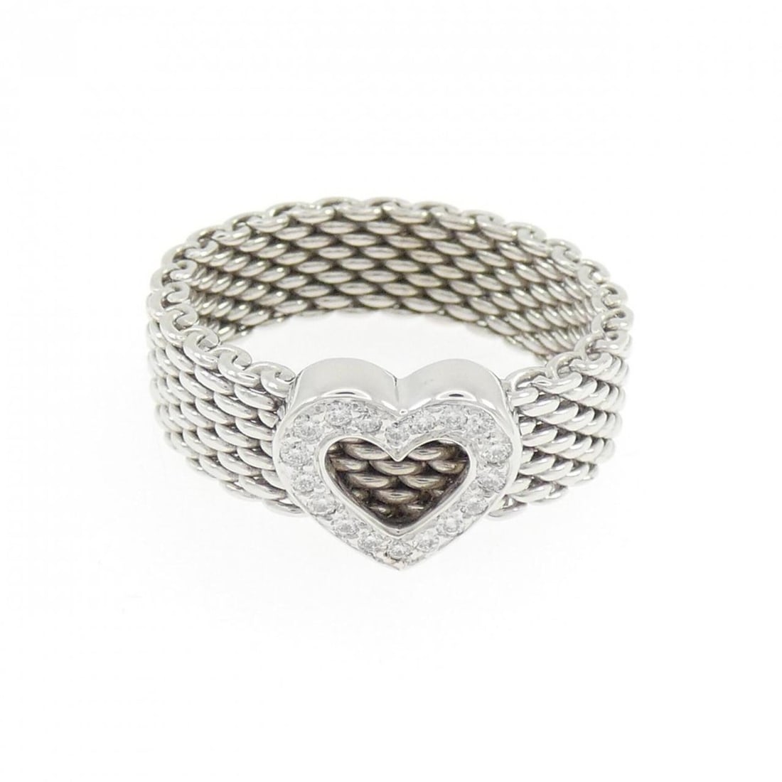 Tiffany & Co. Somerset Heart Ring: --- Catalog ---Category: SizeJP Size: 15US Size: 7.5Category: DesignType: Band ringGender: WomenMaterial: White gold (18K)Category: GeneralBrand: Tiffany--- Item List ---Section: ConditionRanking: