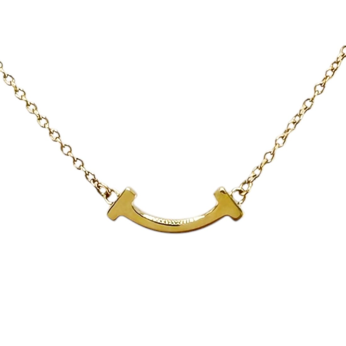 Tiffany & Co. T Smile Necklace, 18K Yellow Gold, Women's.: --- Catalog ---Category: SizeWidth: 0.8mm / 0.03''Weight: 2.3g / 0.08oz.Pendant Size: 4mm x 13.5mm / 0.15'' x 0.53''Neck Circumference: 49 cm / 19.29''Category: DesignColor: GoldGender: WomenHandmade: