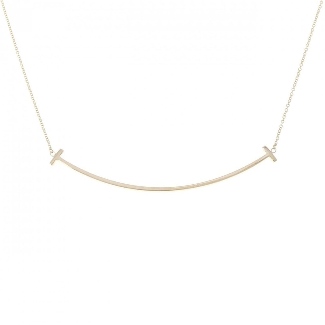 Tiffany & Co. T Smile Large Necklace: --- Catalog ---Category: SizePendant Size: 6.1mm x 68.5mm / 0.24'' x 2.69''Neck Circumference: 41 cm - 46 cm / 16.14'' - 18.11''Category: DesignGender: WomenMaterial: Yellow gold (18K)Pendant Type: