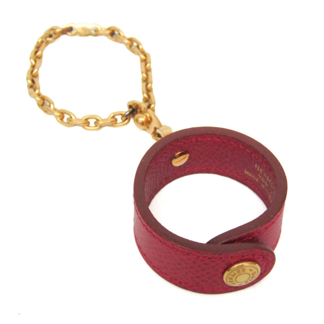 Hermes Nomade Women's Glove Holder Gold,Red Color: --- Catalog ---Category: SizeSize (HxWxD): 10.5cm x 3.5cm x 1.5cm / 4.13'' x 1.37'' x 0.59''Handle/Strap Length: 13cm / 5.11''Category: DesignType: Glove holderColor: Gold, Red colorGender: WomenMater