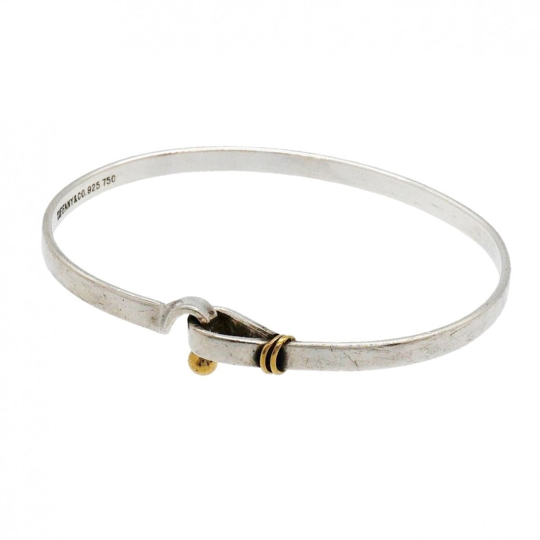 Tiffany & Co. Hook Eye Bangle, 18K Yellow Gold (KYG), Sterling Silver 925, for Men and Women: --- Catalog ---Category: SizeLength: 17.5cm / 6.88''Category: DesignType: BangleGender: Men,WomenMaterial: Silver 925, Yellow gold (18K)Category: GeneralBrand: Tiffany--- Item List ---Section: Conditi