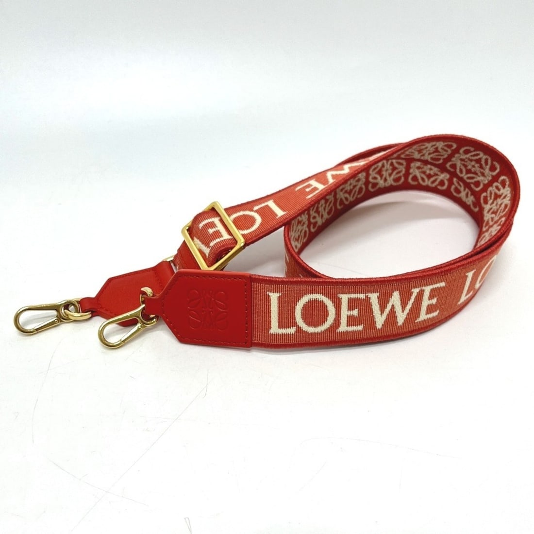 LOEWE Anagram Jacquard Logo Adjustable Shoulder Strap Bag, Canvas and Leather, Women's, Orange: --- Catalog ---Category: SizeSize (HxWxD): 105cm x 4cm / 41.33'' x 1.57''Category: DesignType: StrapColor: OrangeGender: WomenMaterial: Canvas, LeatherCategory: GeneralBrand: LoeweCountry of Origin: S