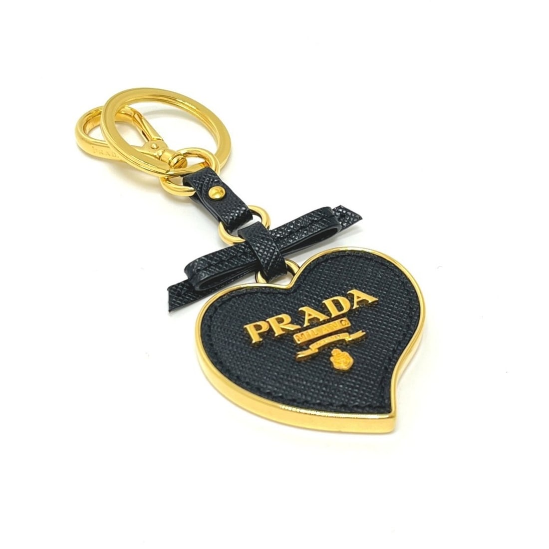 PRADA 1TL126 Saffiano Toys Heart Keyring Trick Keychain Bag Charm Leather Women's Black: --- Catalog ---Category: SizeSize (HxWxD): 11.5cm x 5cm / 4.52'' x 1.96''Category: DesignType: KeyringColor: Black, GoldGender: WomenCategory: GeneralMPN: 1TL126Brand: Prada--- Item List ---Section: C