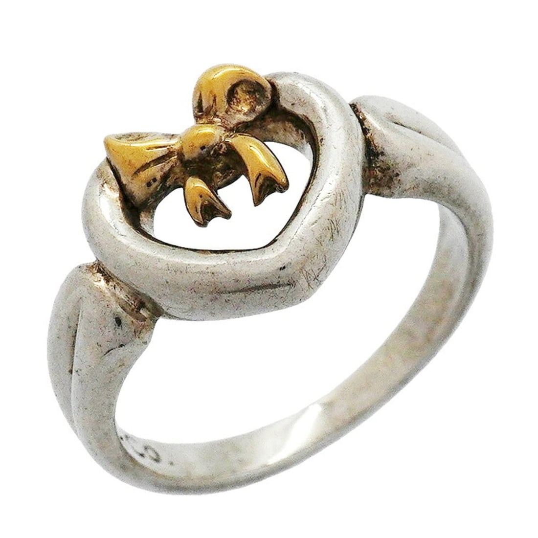 Tiffany & Co. Heart Ribbon Ring, 18K Yellow Gold (KYG), Sterling Silver 925, Size 8.5, Women's: --- Catalog ---Category: SizeJP Size: 8.5US Size: 4.5Category: DesignType: Band ringGender: WomenMaterial: Silver 925, Yellow gold (18K)Category: GeneralBrand: Tiffany--- Item List ---Section: Conditi