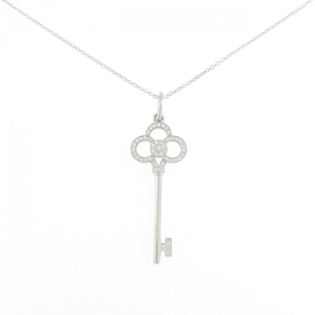 Tiffany Crown Key Mini Necklace 0.11CT: --- Catalog ---Category: SizePendant Size: 41mm x 13.5mm / 1.61'' x 0.53''Neck Circumference: 51 cm / 20.07''Category: DesignGender: WomenMaterial: White gold (18K)Pendant Type: PendantNecklace Type: