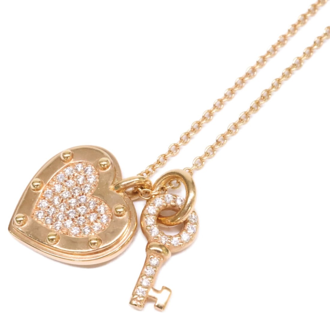 TIFFANY&Co. Tiffany 750 Return to Love Heart Tag Key Diamond Necklace, Yellow Gold, Women's: --- Catalog ---Category: SizePendant Size: 11.5mm / 0.45''Neck Circumference: 46 cm / 18.11''Category: DesignColor: Yellow goldStone: DiamondGender: WomenMaterial: Yellow gold (18K)Necklace Type: Neck