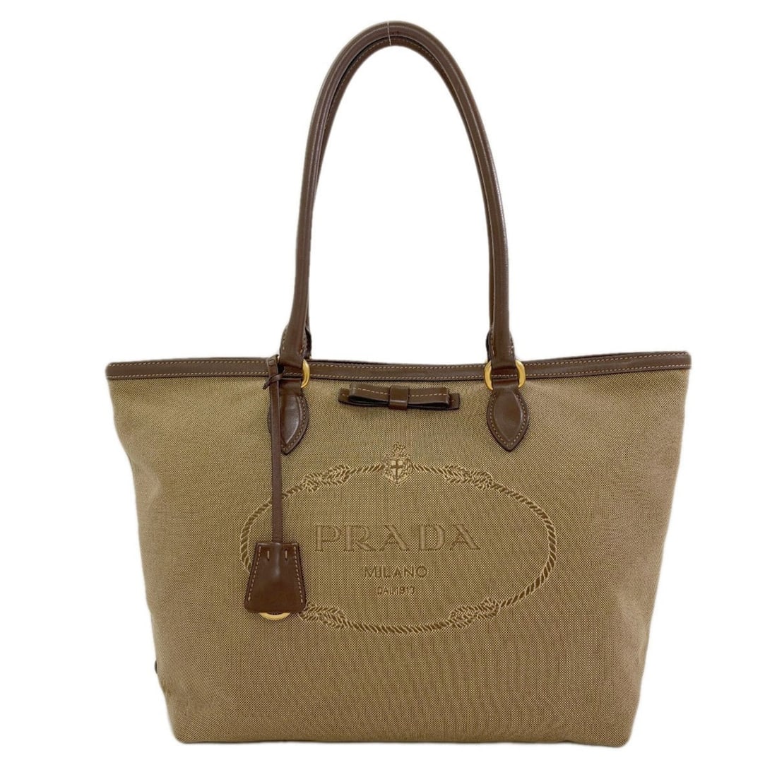 Prada 1BG158 Fiocco Logo Tote Bag Canvas/Leather Women's PRADA: --- Catalog ---Category: SizeSize (HxWxD): 26cm x 41cm x 15cm / 10.23'' x 16.14'' x 5.9''Handle Length: 45cm / 17.71''Category: DesignType: Tote bagColor: BrownGender: WomenMaterial: Canvas , Leather