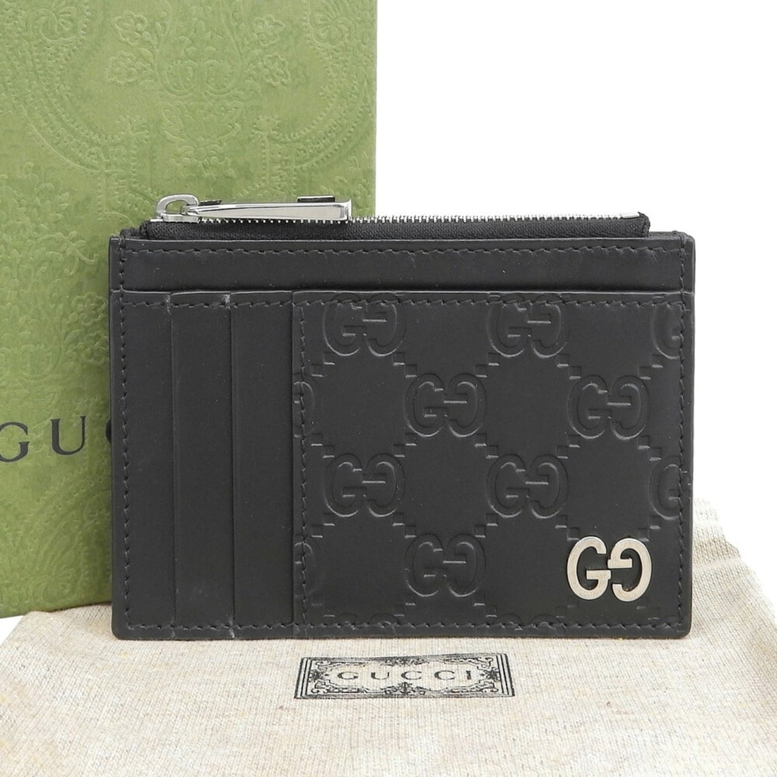 Gucci Guccissima Signature GG Fragment Case 597560?1147 Coin Leather Black: --- Catalog ---Category: SizeSize (HxWxD): 8cm x 11.5cm x 1.5cm / 3.14'' x 4.52'' x 0.59''Category: DesignType: Coin purse/coin caseColor: BlackGender: Women,MenMaterial: Leather Category: GeneralMPN: