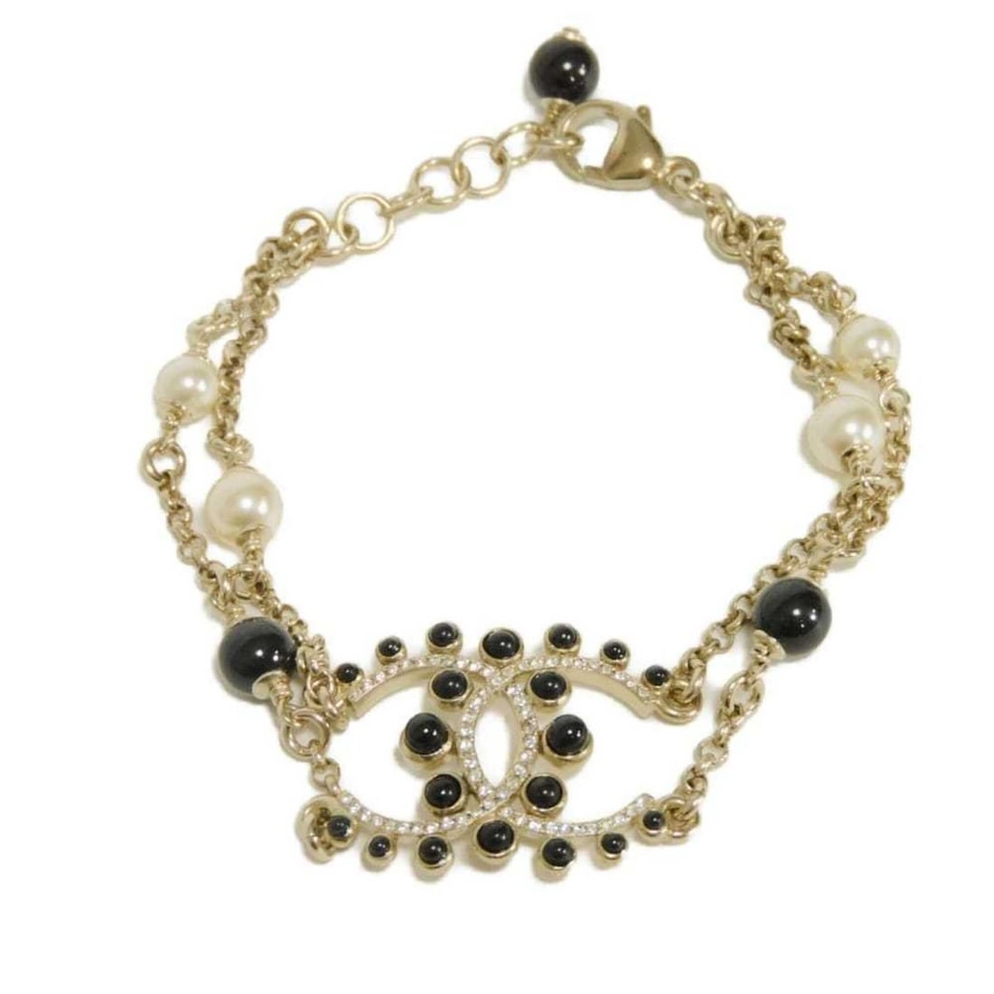 Chanel bracelet with Coco Mark, crystal chain, pearl, black stone, rhinestone, gold G19V CC mark,: --- Catalog ---Category: SizeLength: 17cm / 6.69''Category: DesignType: Charm braceletColor: Black, Champagne gold, IvoryGender: WomenMaterial: RhinestoneCategory: GeneralBrand: Chanel--- Item List --
