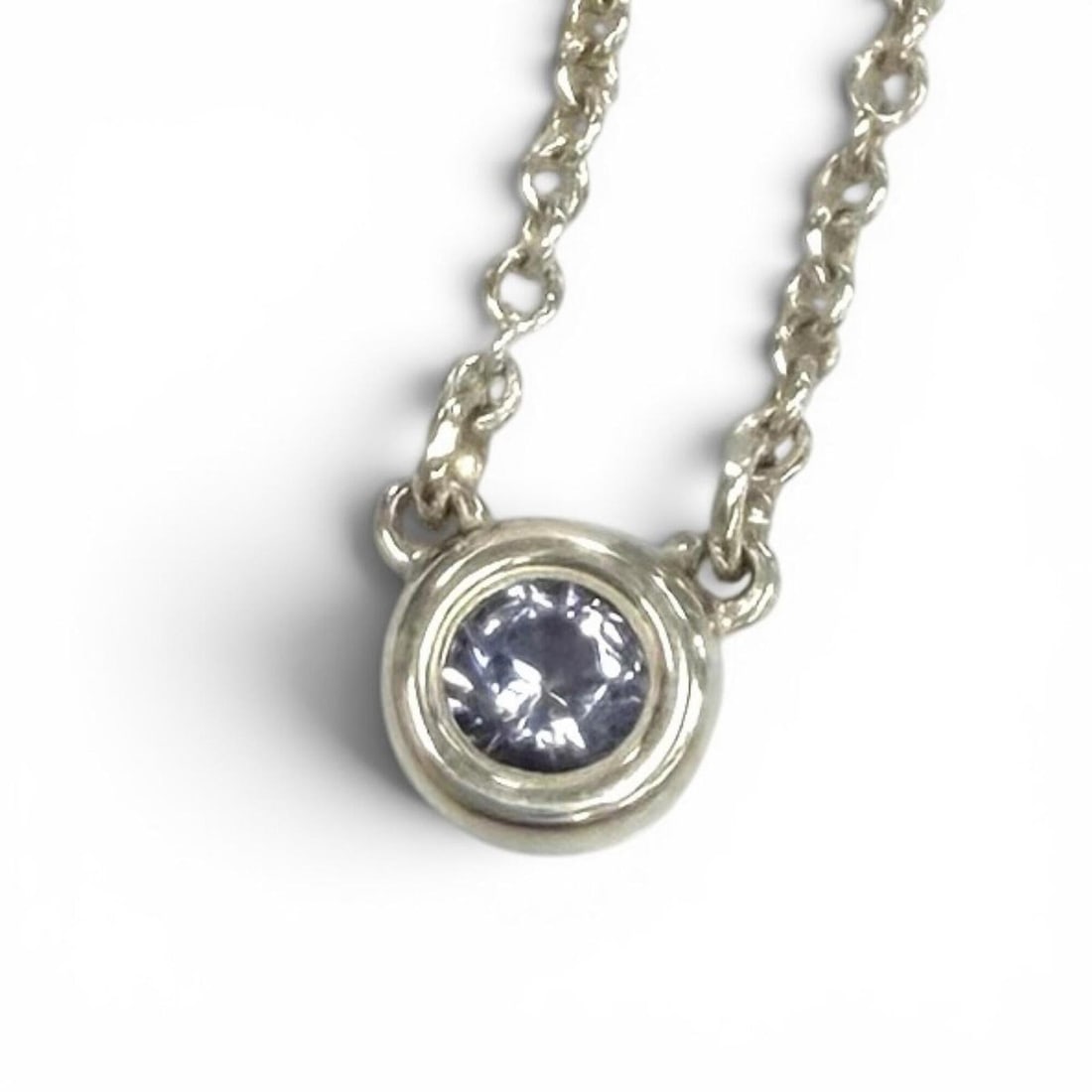 TIFFANY&Co. Tiffany & Co. Elsa Peretti Color by the Yard Tanzanite Pendant Necklace, 925 Sterling: --- Catalog ---Category: SizePendant Size: 4mm / 0.15''Neck Circumference: 41.1 cm / 16.18''Category: DesignColor: Blue, SilverStone: TanzaniteGender: WomenMaterial: Silver 925Necklace Type: NecklaceC